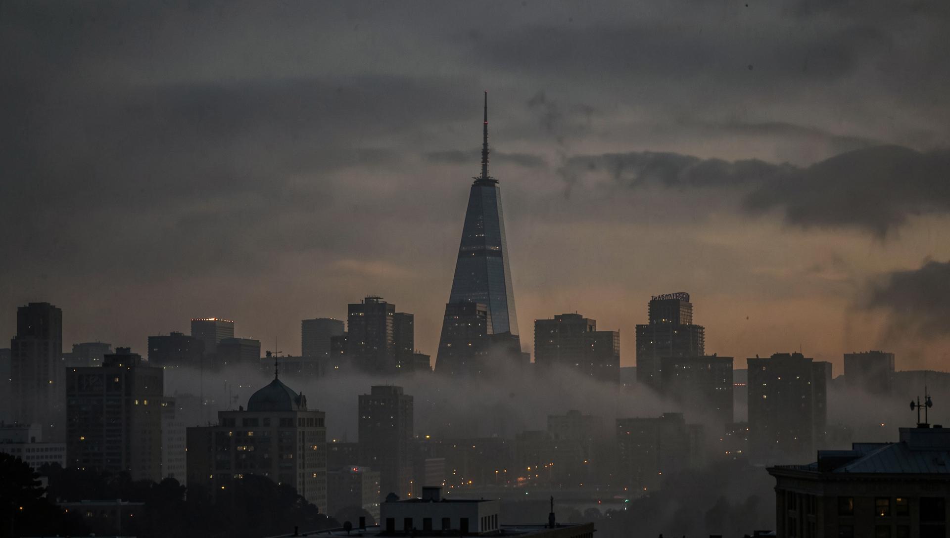 San Francisco skyline with the Transamerica Pyramid rising through evening fog